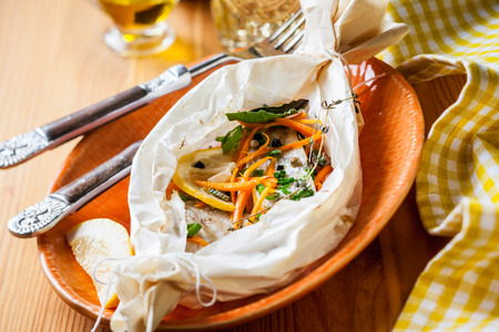 Cod fillets  baked in parchment paperの写真素材