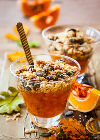 Sweet pumpkin crumble with pumpkin seeds and pine nutの写真素材