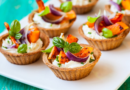 mini tarts with pumpkin and  soft cheese for holidayの写真素材