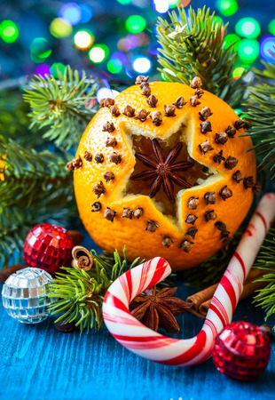 Oranges pierced with cloves,Christmas spices and nutsの写真素材