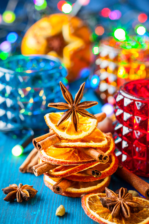 Christmas tree made out of dried oranges and spices with candles for holidayの写真素材