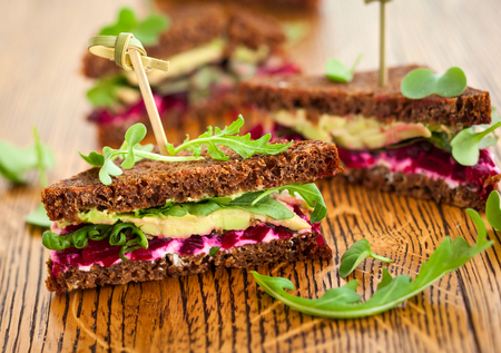 sandwich with beet,cheese,avocado and arugulaの写真素材