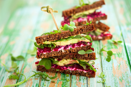 sandwich with beet,cheese,avocado and arugulaの写真素材