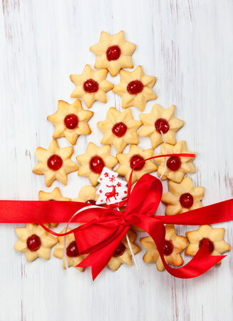Christmas cookies with red candied cherriesの写真素材