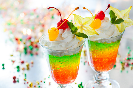 Layered sparkling jelly with cream and fruits for holidayの写真素材