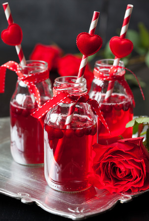 Valentine\'s Day party idea:individual small bottles with cranberry cocktailの写真素材