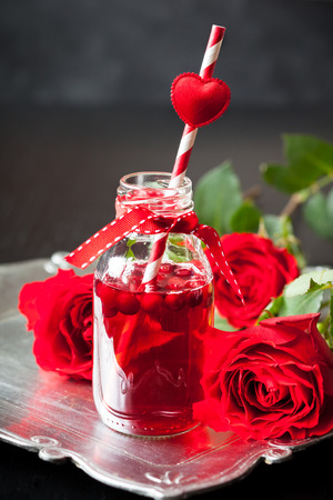 Valentine's Day party idea:individual small bottles with cranberry cocktailの写真素材