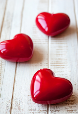 Red hearts on the vintage wooden backgroundの写真素材