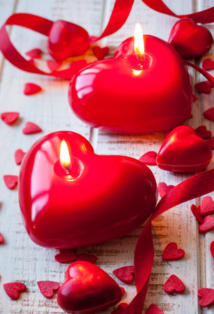 Heart shaped candles and sweet candy for Valentineの写真素材