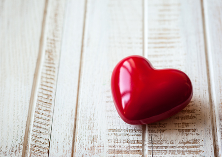 Red heart on the vintage wooden backgroundの写真素材