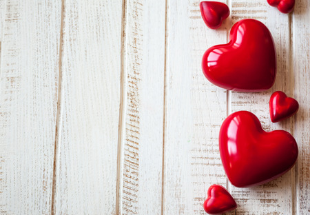 Red hearts on the vintage wooden backgroundの写真素材