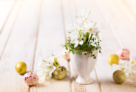 Easter decoration with spring flowers and chocolate eggsの写真素材