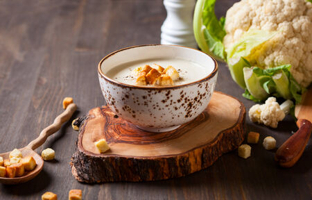 Cauliflower cream soup  with croutonsの写真素材