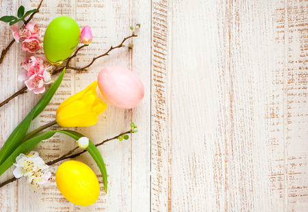 Colorful easter eggs and spring flowersの写真素材
