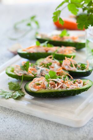 Fresh cucumber stuffed with carrot,cheese and garlicの写真素材