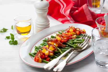 Green beans with bacon and vegetablesの写真素材