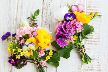Beautiful bunch of flowers on the wooden tableの写真素材
