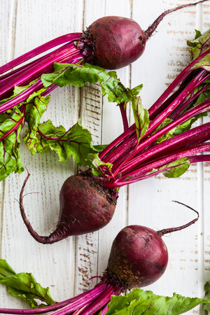 Fresh organic beetroot with green leavesの写真素材