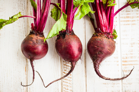 Fresh organic beetroot with green leavesの写真素材