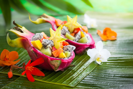 Exotic fruit salad served in half a dragon fruit