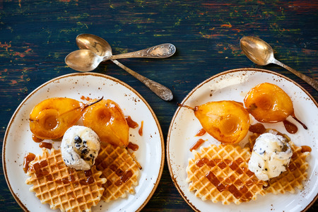 Caramelized pears with waffles, ice-cream and caramel sauce