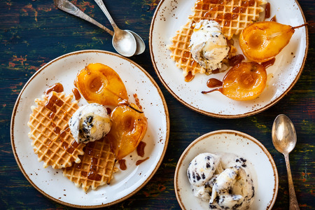 Caramelized pears with waffles, ice-cream and caramel sauceの写真素材