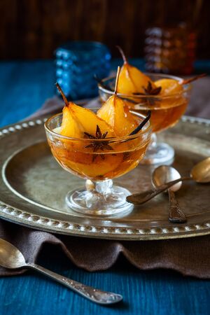 Poached pears in spiced syrup for holidayの写真素材