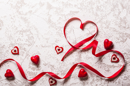 Valentines Day background with hearts and red tulipsの写真素材