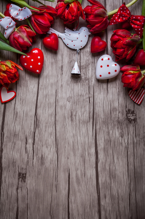 Valentines Day background with chocolates, hearts and red tulipsの写真素材