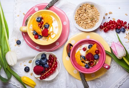 Healthy breakfast with muesli, yogurt and fresh berries in cupの写真素材