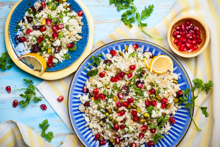 Cauliflower couscous with dried cranberry, pomegranate, pistachio and pine nutの写真素材