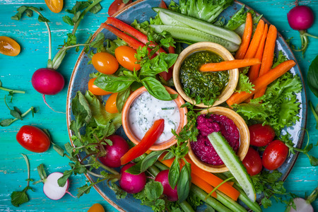Veggie crudite platter with three different dipsの写真素材