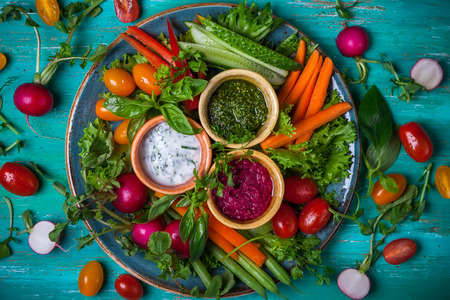 Veggie crudite platter with three different dipsの写真素材