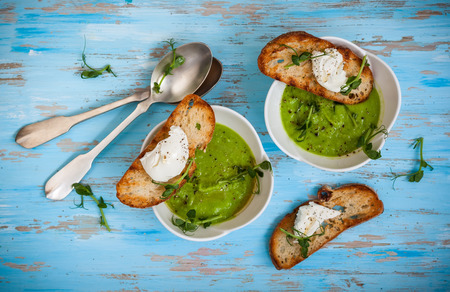 Green pea soup with goat's cheese crostiniの写真素材
