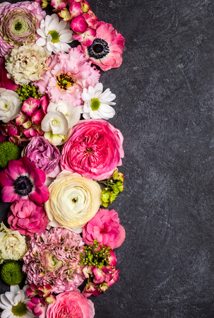 Various flowers on black background. Overhead view with copy spaceの写真素材