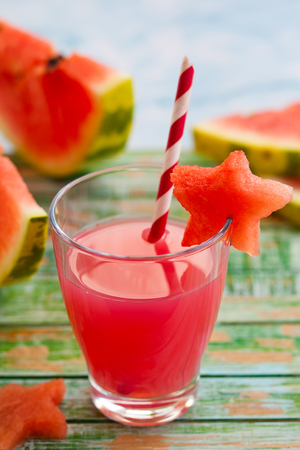 Watermelon drink in glasses with slices of watermelon in star shapeの写真素材