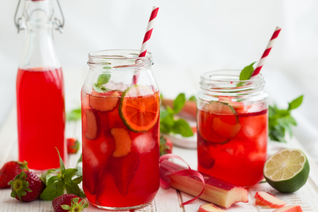 Preparation homemade refreshing  strawberry,lime and rhubarb lemonade with mintの写真素材