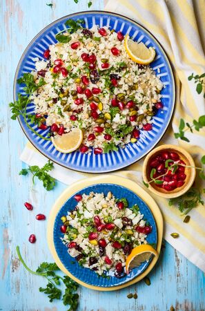 Cauliflower couscous with dried cranberry, pomegranate, pistachio and pine nutの写真素材