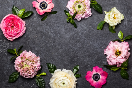 Various flowers on black background. Overhead view with copy spaceの写真素材