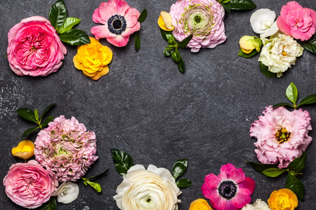 Various flowers on black background. Overhead view with copy spaceの写真素材
