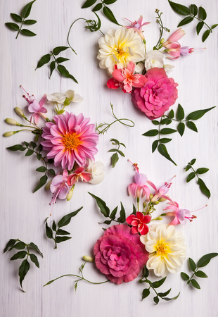 Festive flower composition on the white wooden background. Overhead viewの写真素材