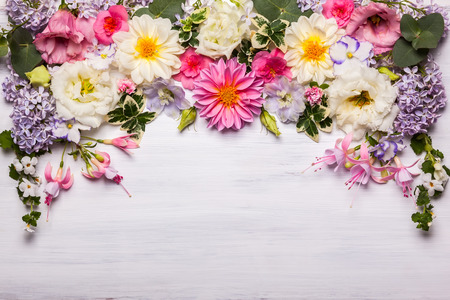 Festive flower composition on the white wooden background. Overhead view