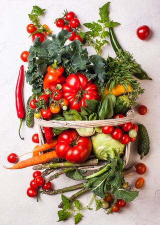 Basket of fresh vegetables on the white background. Top viewの写真素材