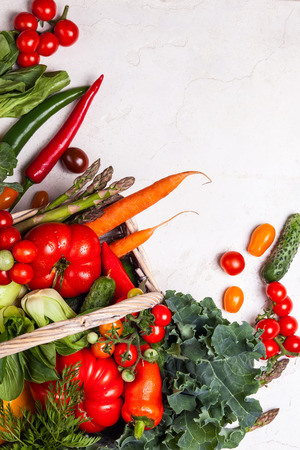 Basket of fresh vegetables on the white background. Top viewの写真素材