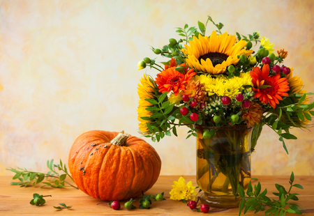 Autumn still life with flowers and pumpkinの写真素材