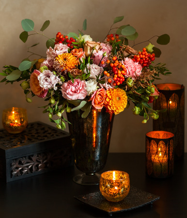 Still life with autumn bouquet and candlesの写真素材