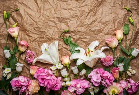Festive flower composition on the crumpled paper background. Top view.の写真素材