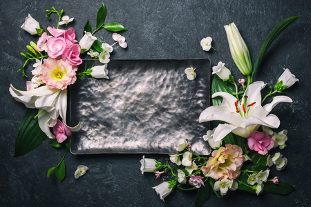 Festive flower composition on the black tableの写真素材