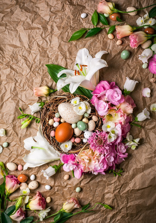 Easter composition with festive flowers decoration and traditional treatsの写真素材