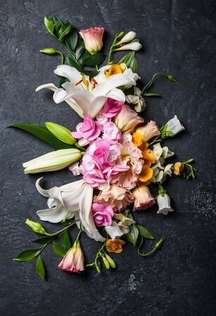 Festive flower composition on the black table.の写真素材